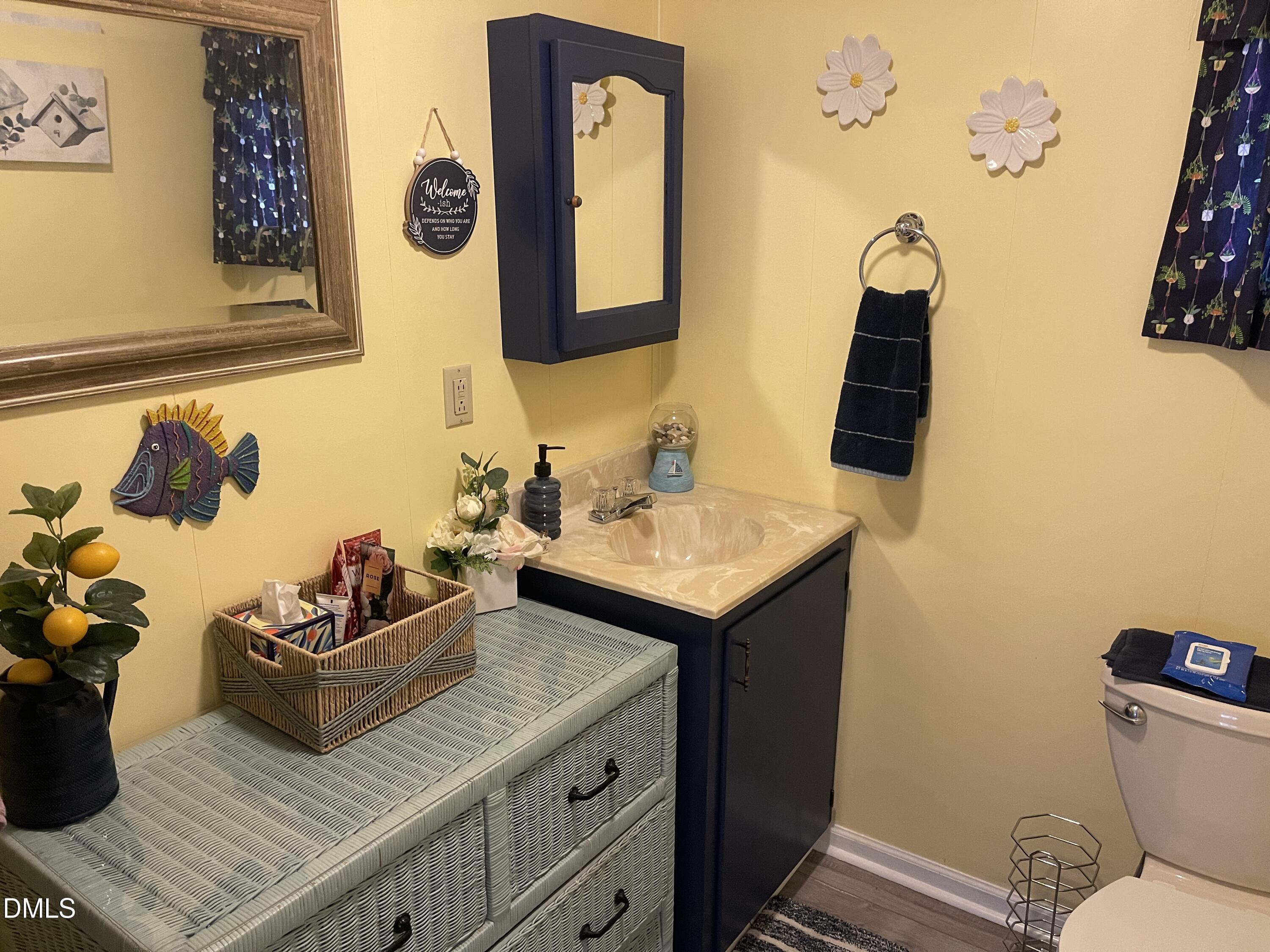 129 Boulder Boulevard Manson, NC 27553 - Photo 26 of 43 a bathroom with a sink mirror and vanity