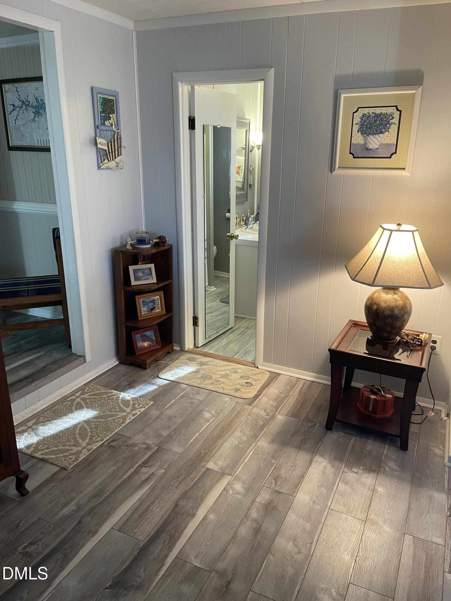 129 Boulder Boulevard Manson, NC 27553 - Photo 27 of 48 a bedroom with bed and a chandelier