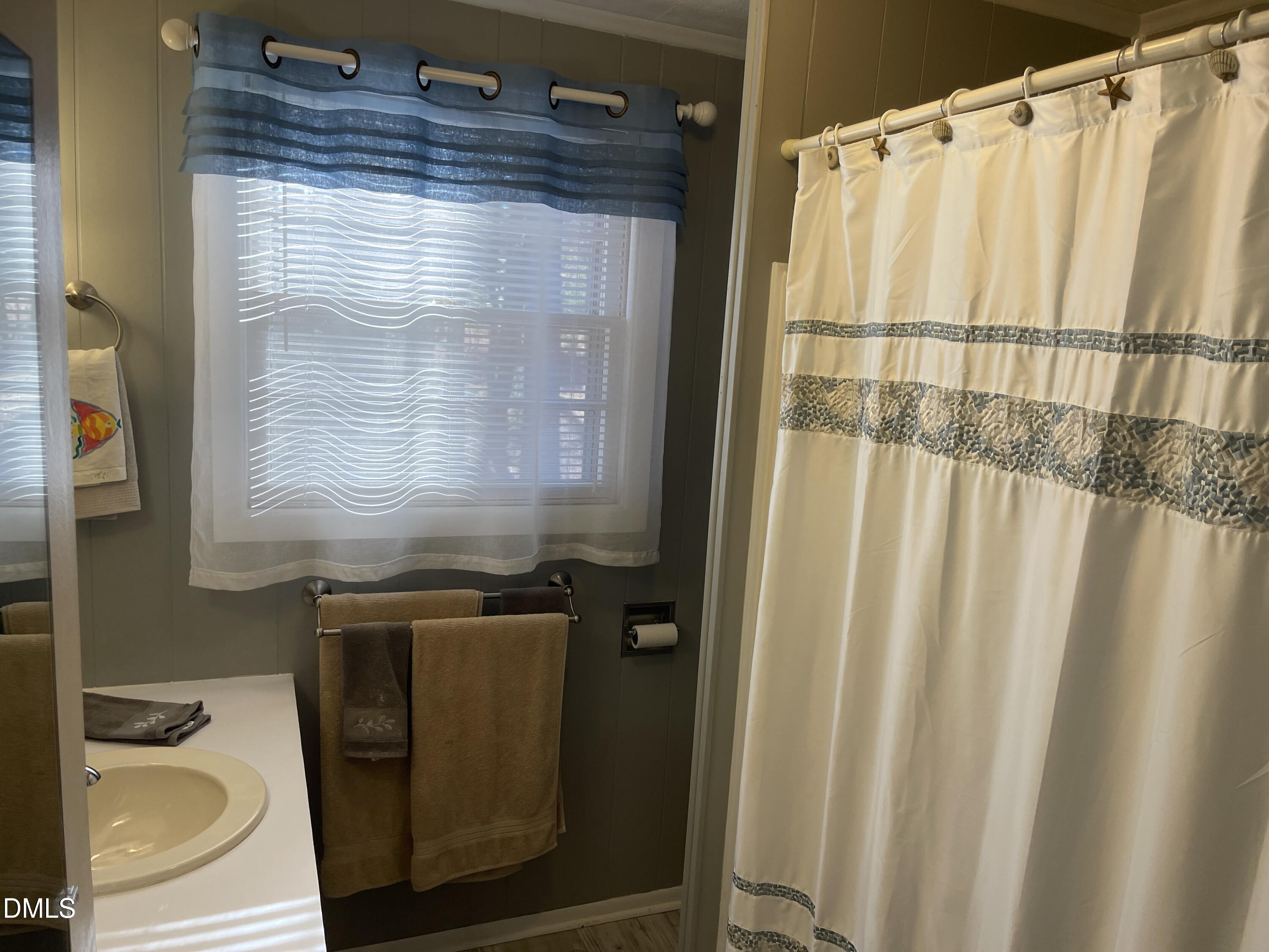 129 Boulder Boulevard Manson, NC 27553 - Photo 27 of 43 a bathroom with a granite countertop sink and a mirror