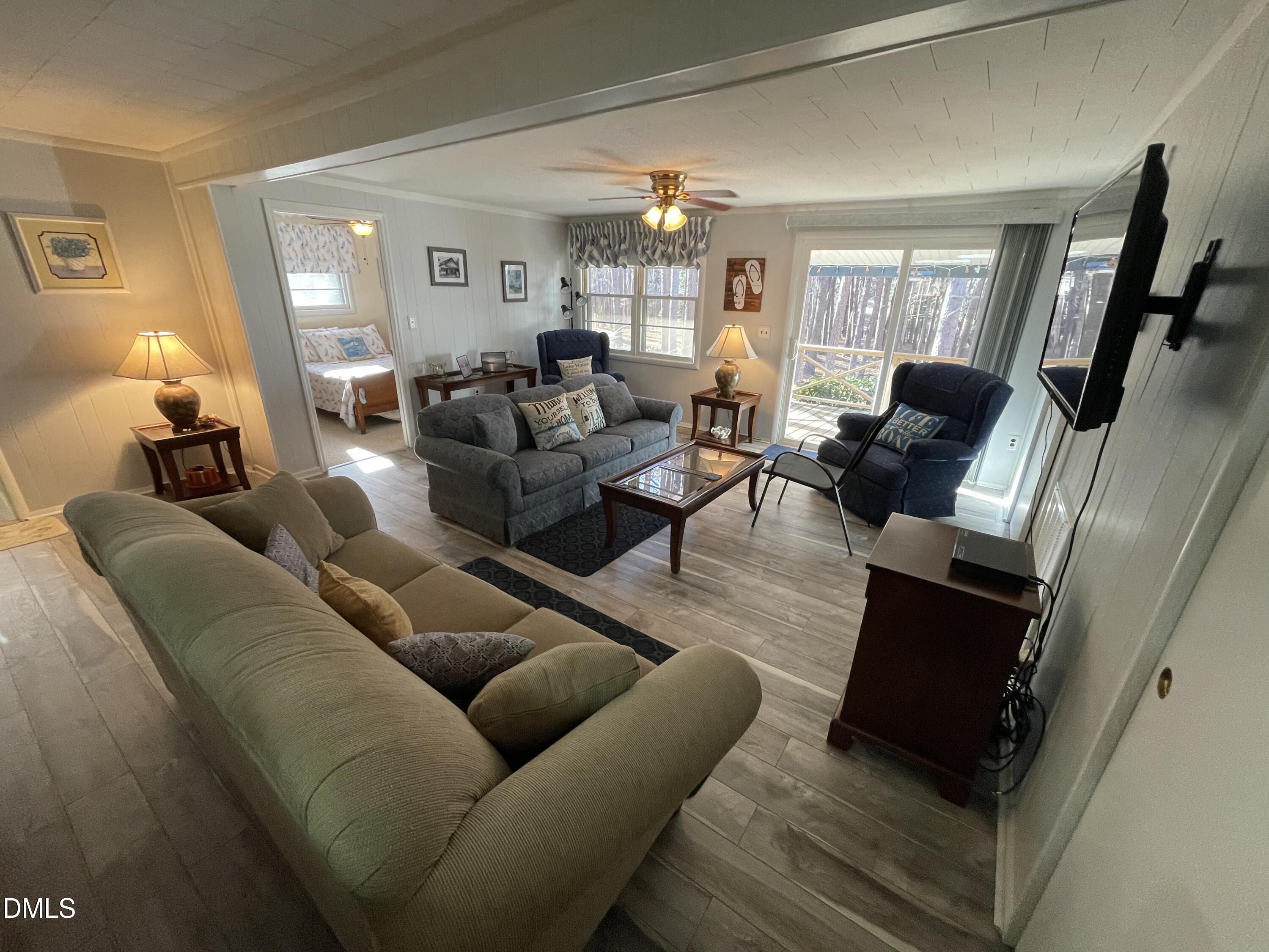 129 Boulder Boulevard Manson, NC 27553 - Photo 36 of 43 a living room with furniture and a wooden floor