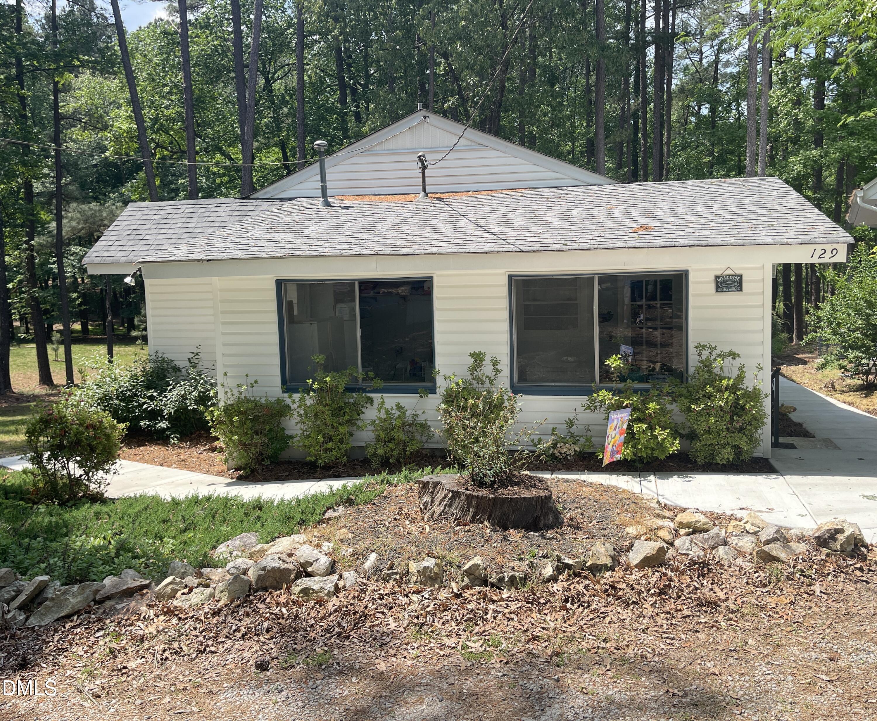 129 Boulder Boulevard Manson, NC 27553 - Photo 4 of 48 a front view of house with a garden