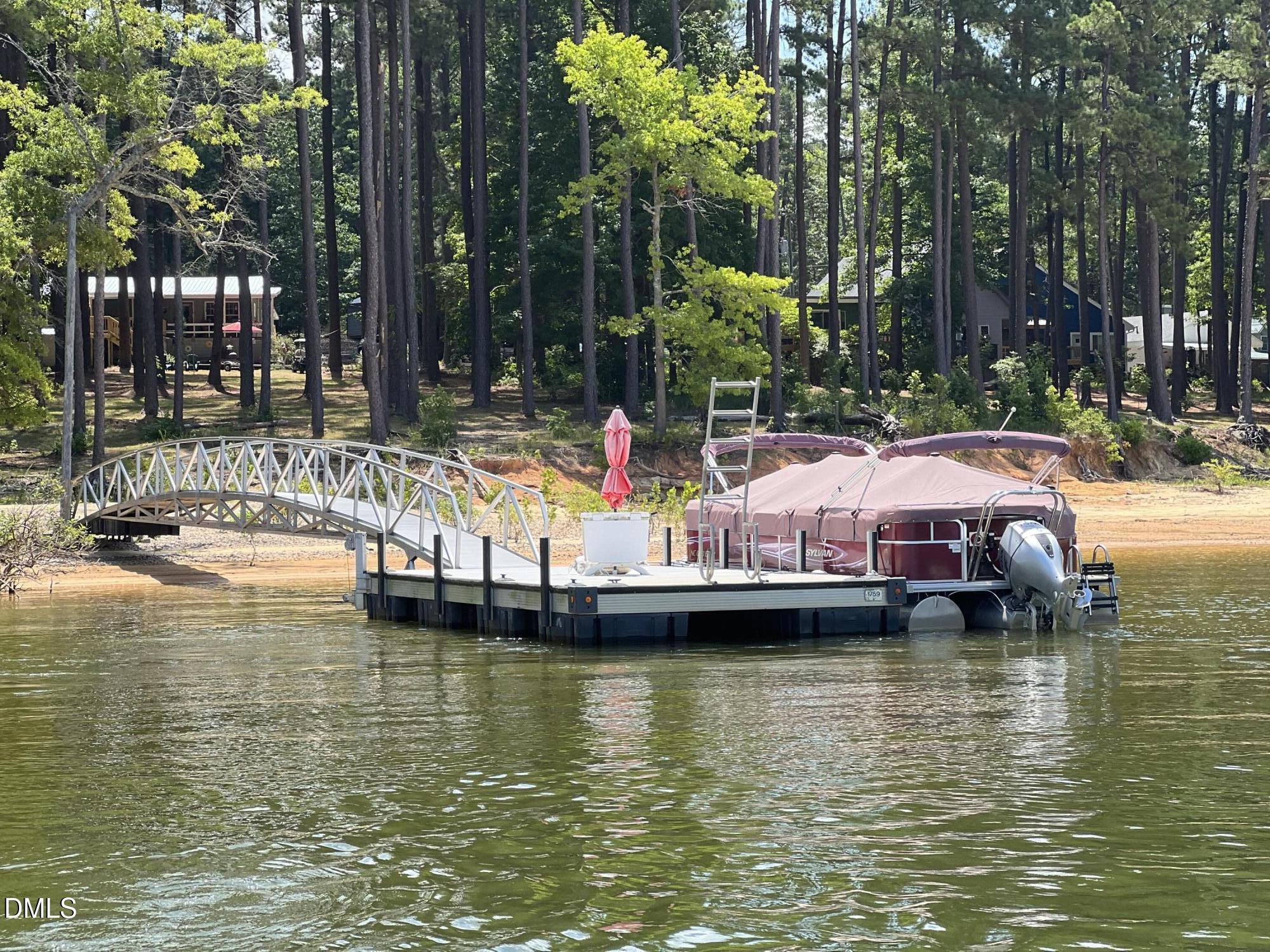 129 Boulder Boulevard Manson, NC 27553 - Photo 41 of 43 a view of a lake with boats and trees around