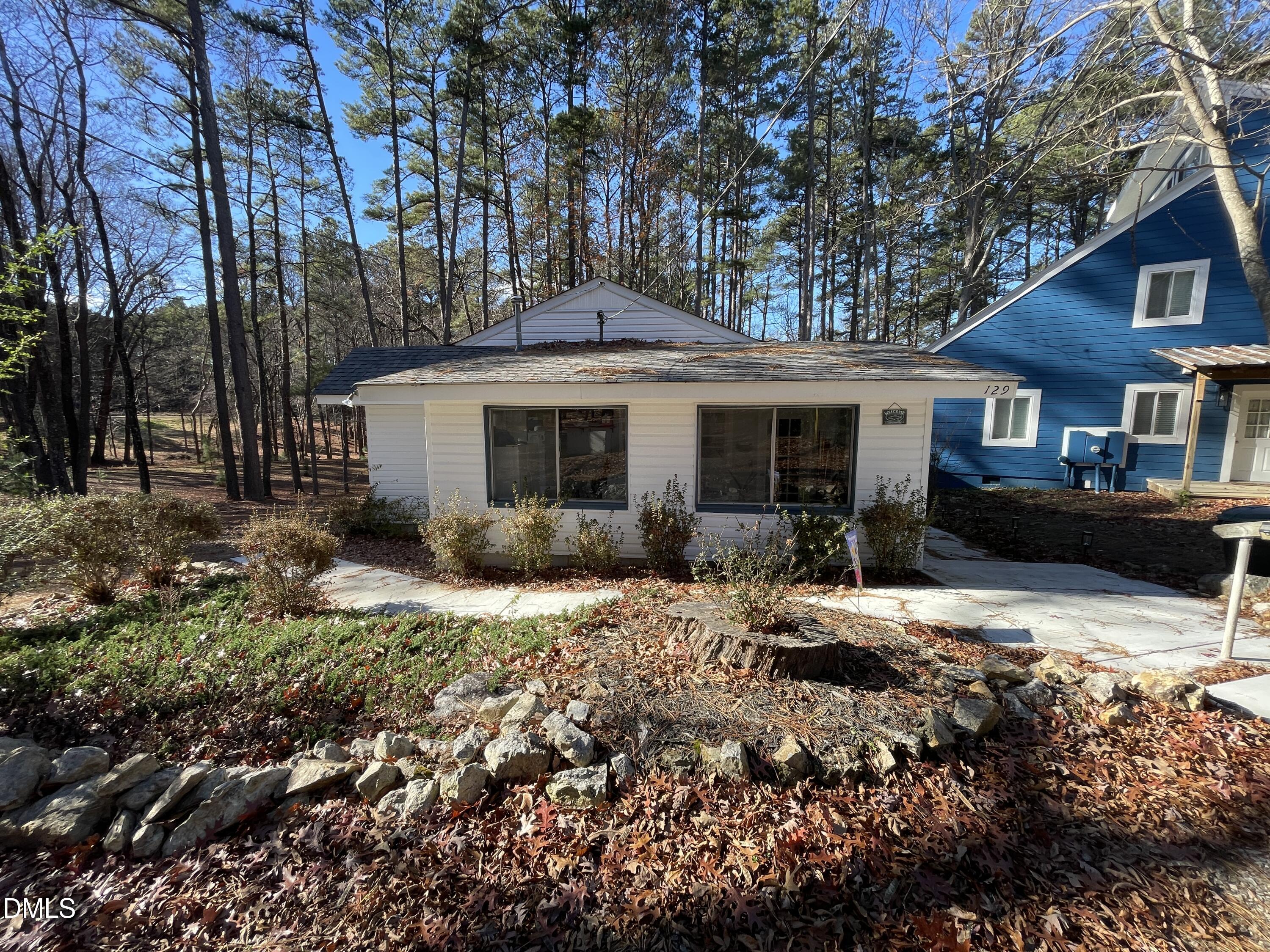 129 Boulder Boulevard Manson, NC 27553 - Photo 7 of 43 a view of a house with a yard covered in snow