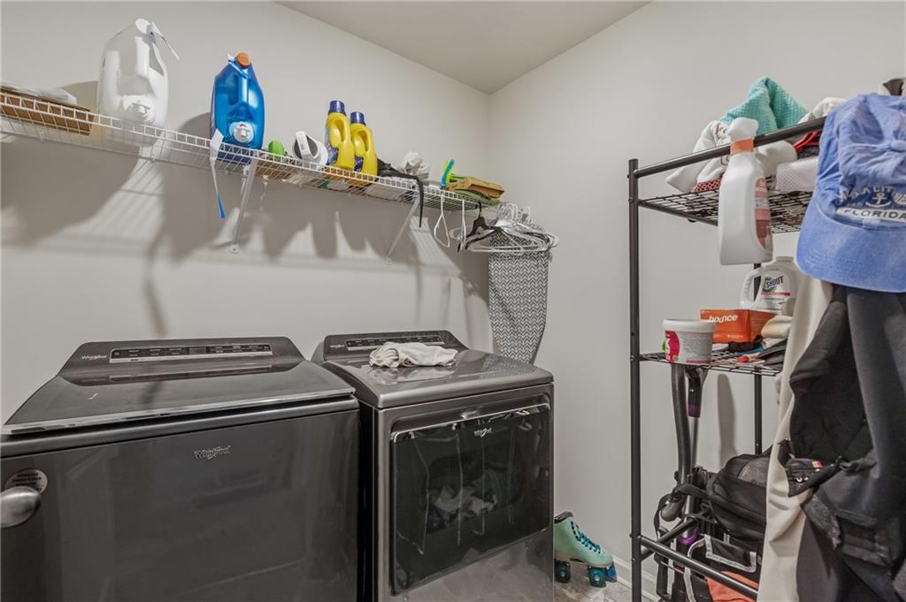575 Walnut Grv Way Pendergrass, GA 30567 - Photo 22 of 39 a utility room with dryer washer and other items