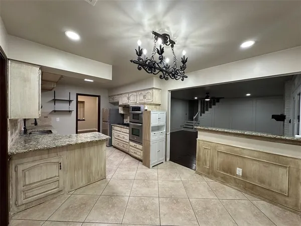 a view of a kitchen from the hallway