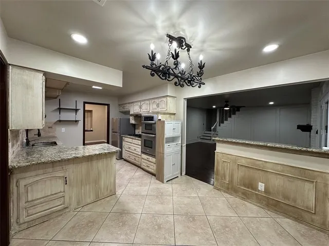 a view of a kitchen from the hallway