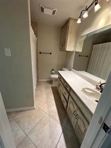 a bathroom with a shower and a bath tub