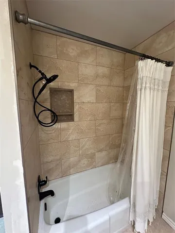 a spacious bathroom with a double vanity sink a mirror and a shower