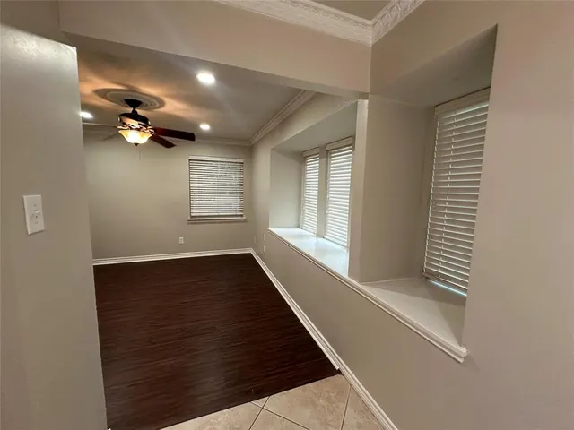 a view of gallery with wooden floor