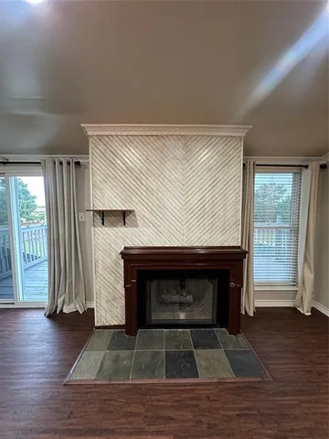 a bathroom with a toilet a sink and glass door