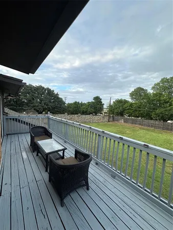 a terrace with outdoor seating and city view