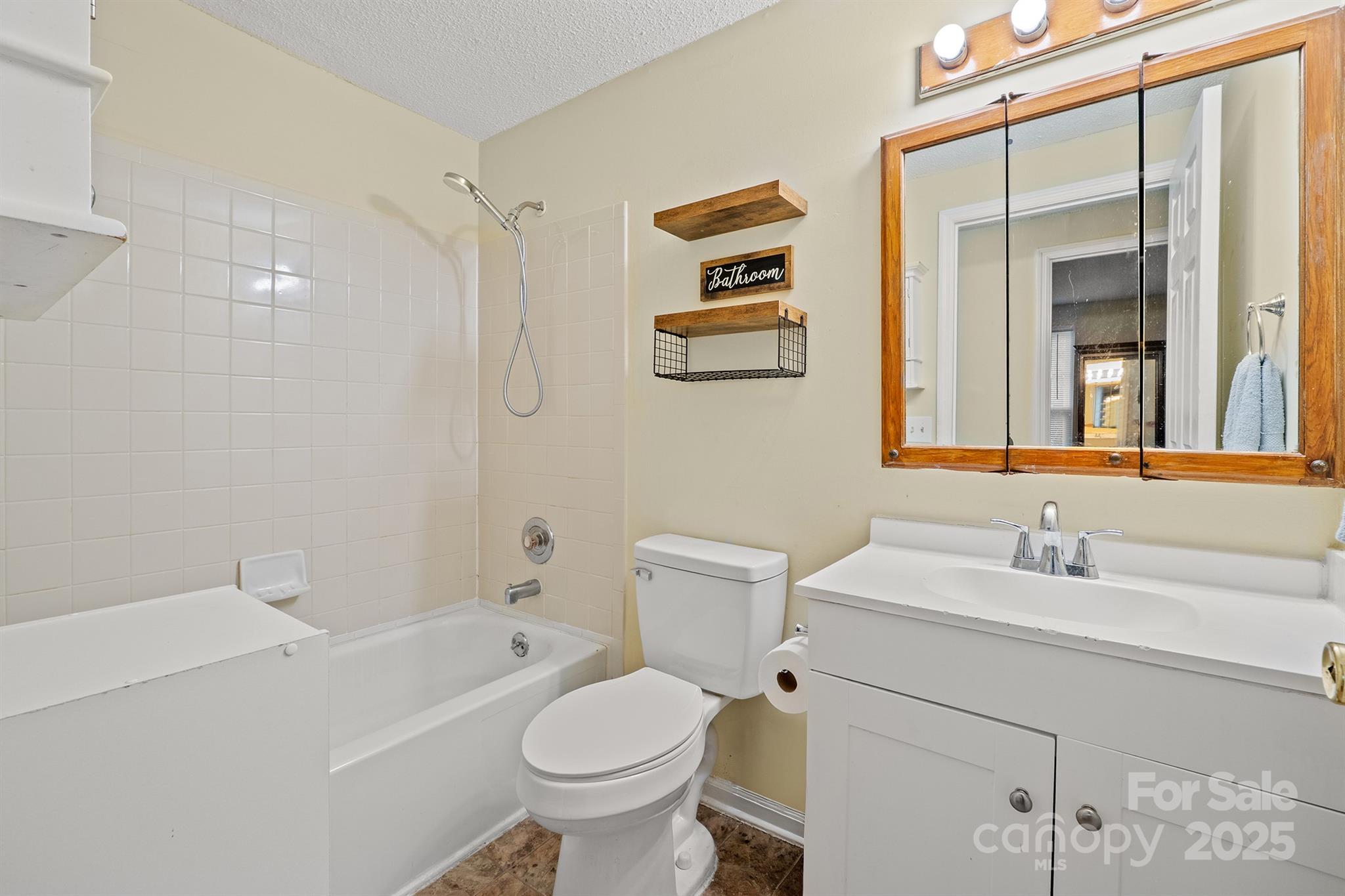 6836 Shiloh Ridge Lane Charlotte, NC 28212 - Photo 23 of 25 a bathroom with a sink toilet and shower