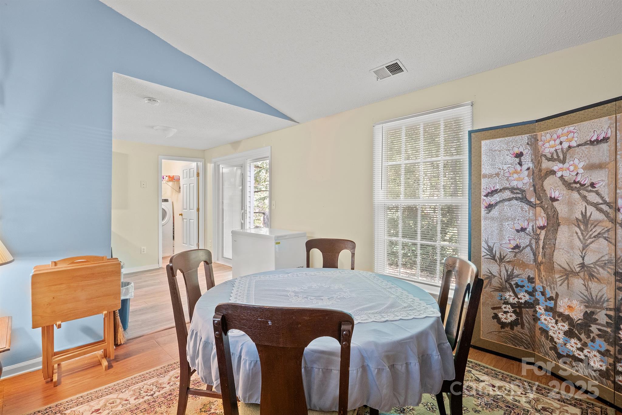 6836 Shiloh Ridge Lane Charlotte, NC 28212 - Photo 8 of 25 a view of a dining room with furniture and wooden floor