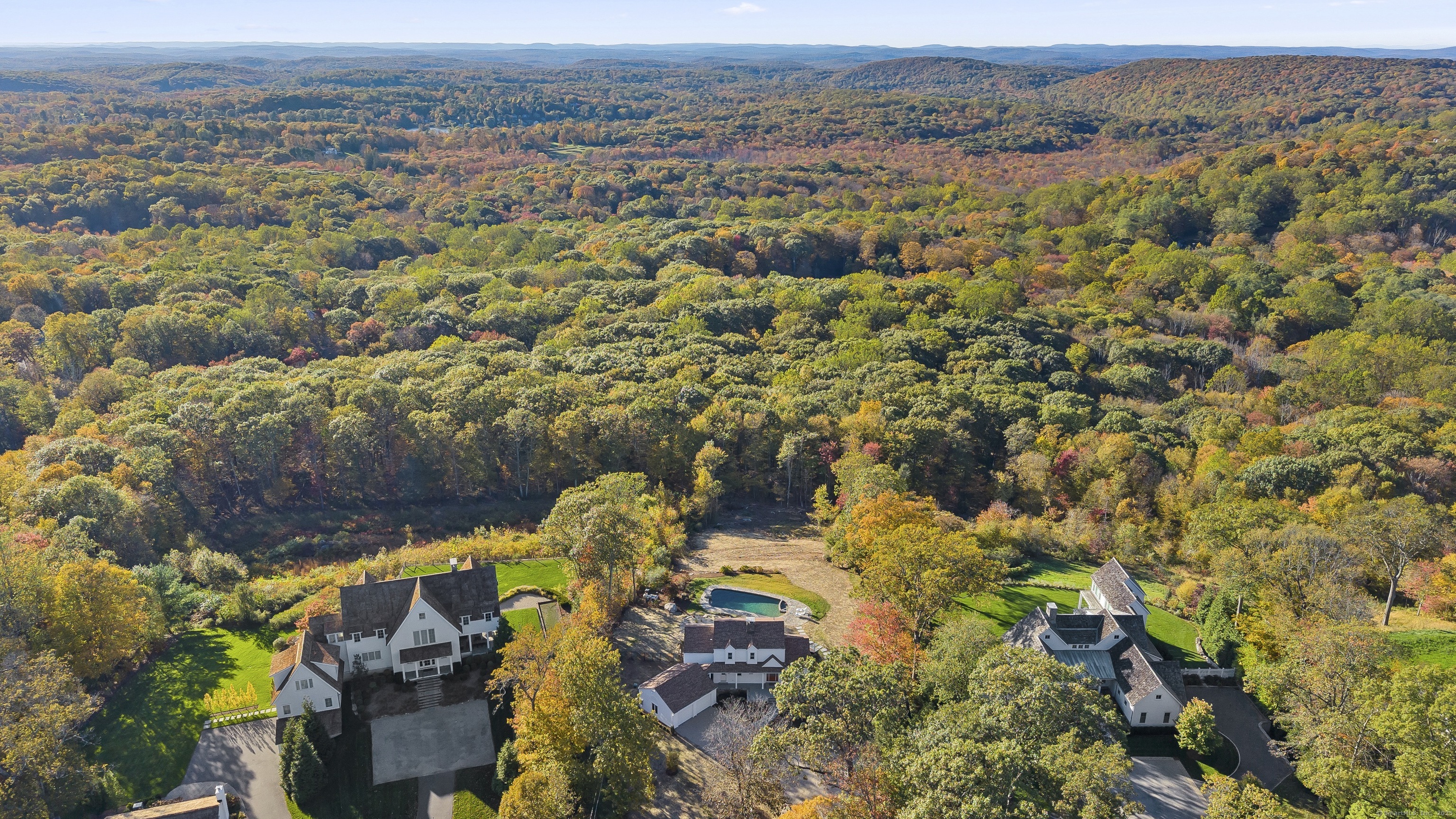 an aerial view of house with yard and mountain view