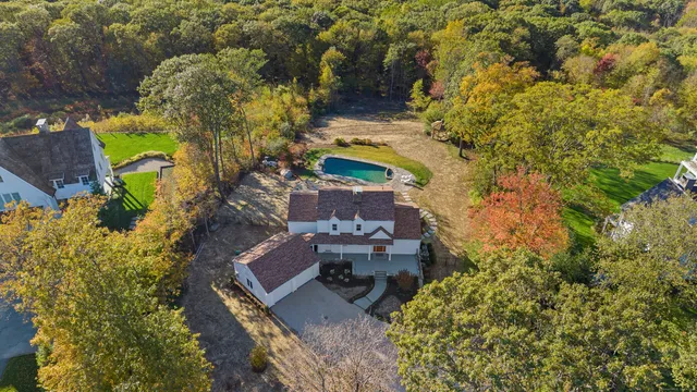 an aerial view of a house with a garden