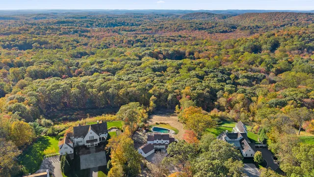 an aerial view of house with yard and mountain view