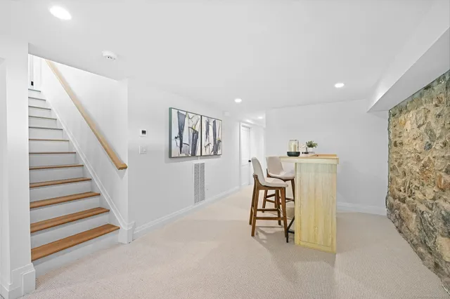a dining room with furniture and entryway