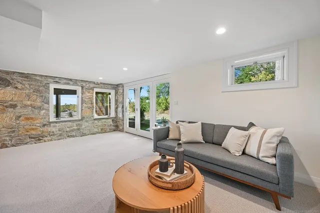 a living room with furniture and a fireplace
