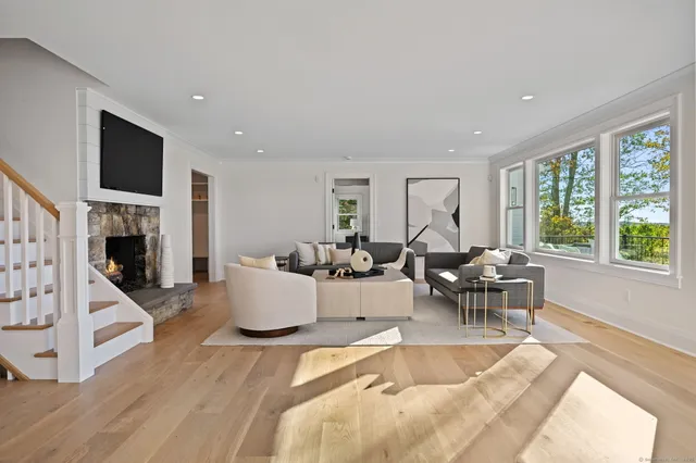 a living room with fireplace furniture and a flat screen tv