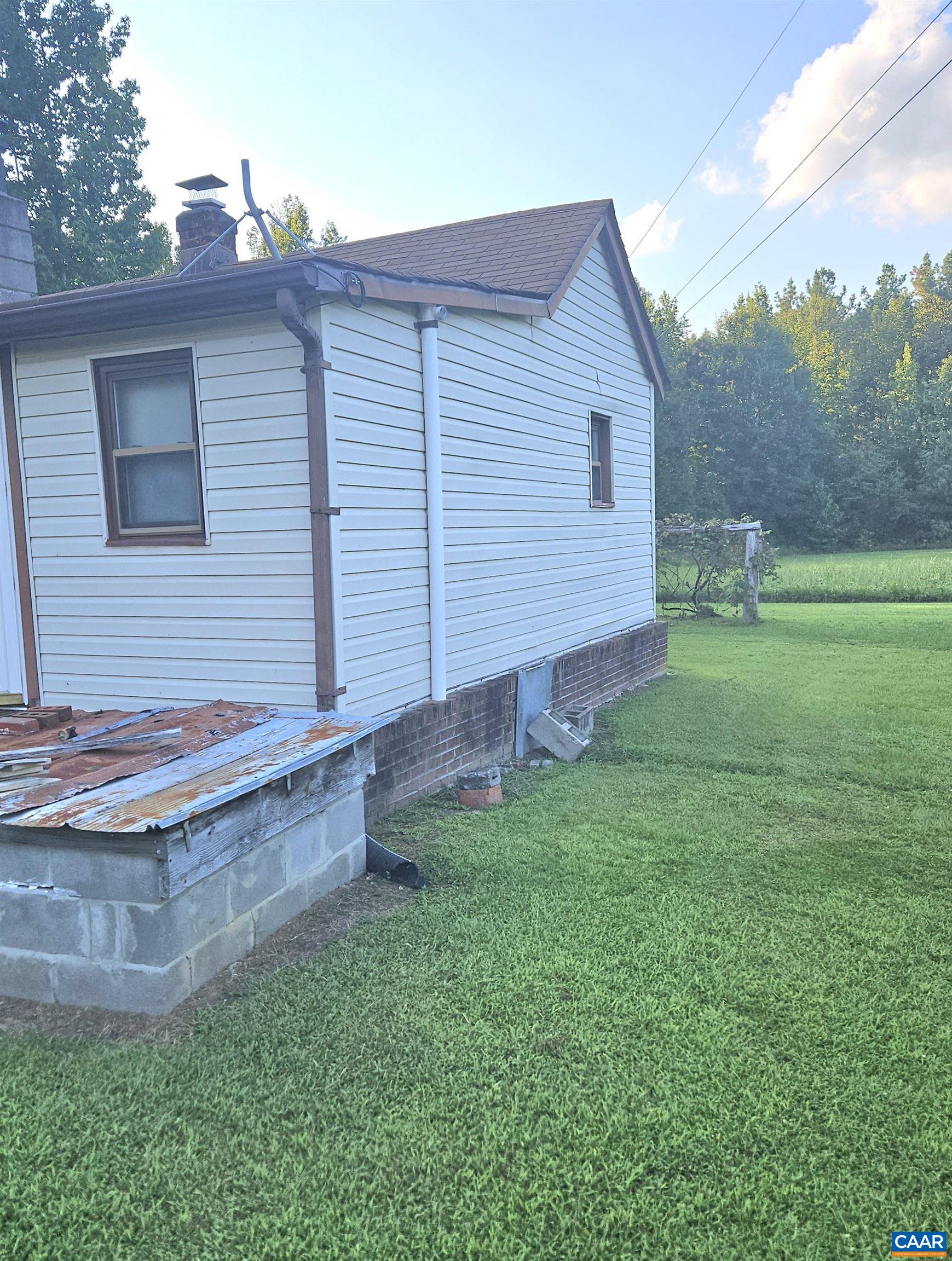 794 Jenkins Church Road Cumberland, VA 23040 - Photo 3 of 7 a view of a backyard with wooden fence