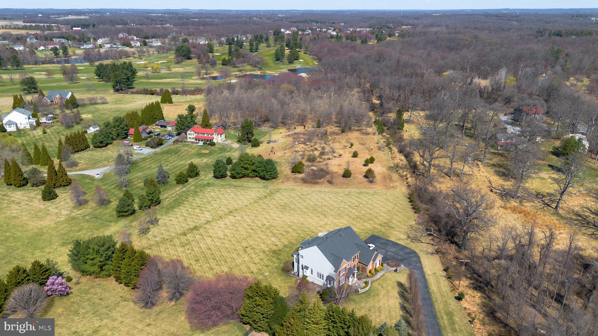 6001 Riggs Road Laytonsville, MD 20882 - Photo 11 of 12 an aerial view of lake residential house with outdoor space