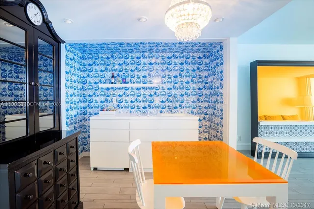 a table with chairs and a stove top oven