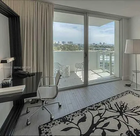 a view of a room with a large window