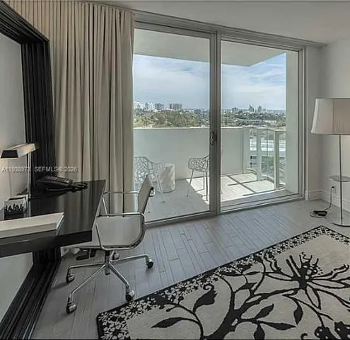 a view of a room with a large window