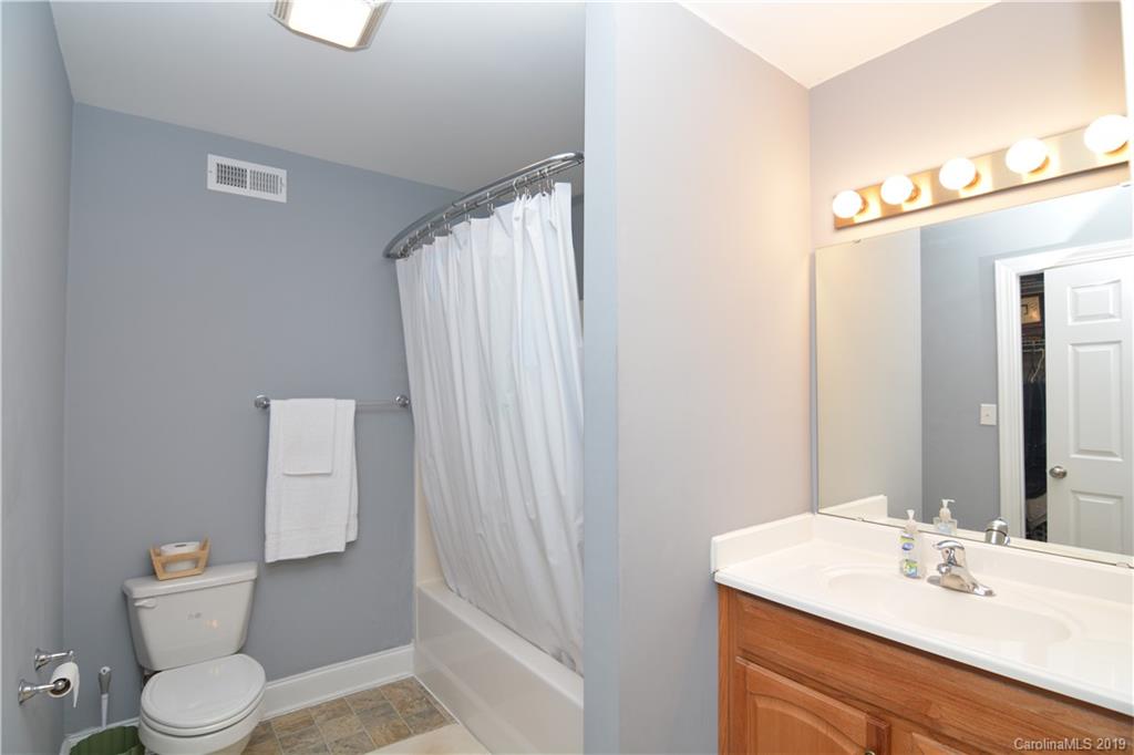 3051 Greenleaf Road Clover, SC 29710 - Photo 22 of 29 a bathroom with a sink a toilet and shower curtain