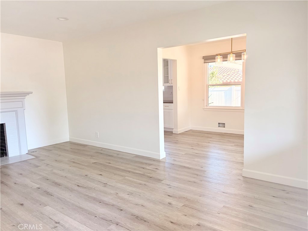 100 Eastern Pasadena, CA 91107 - Photo 5 of 18 a view of an empty room with wooden floor and a window