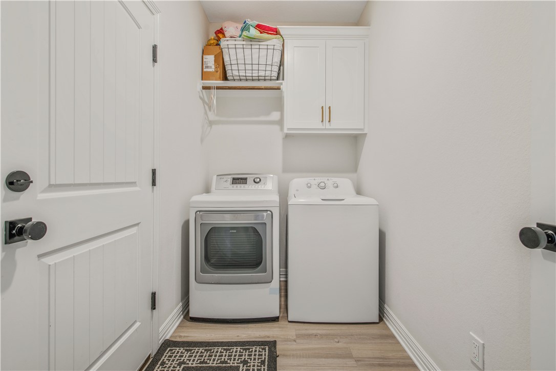 3332 Hunters Crossing Bryan, TX 77808 - Photo 18 of 26 a utility room with dryer and washer