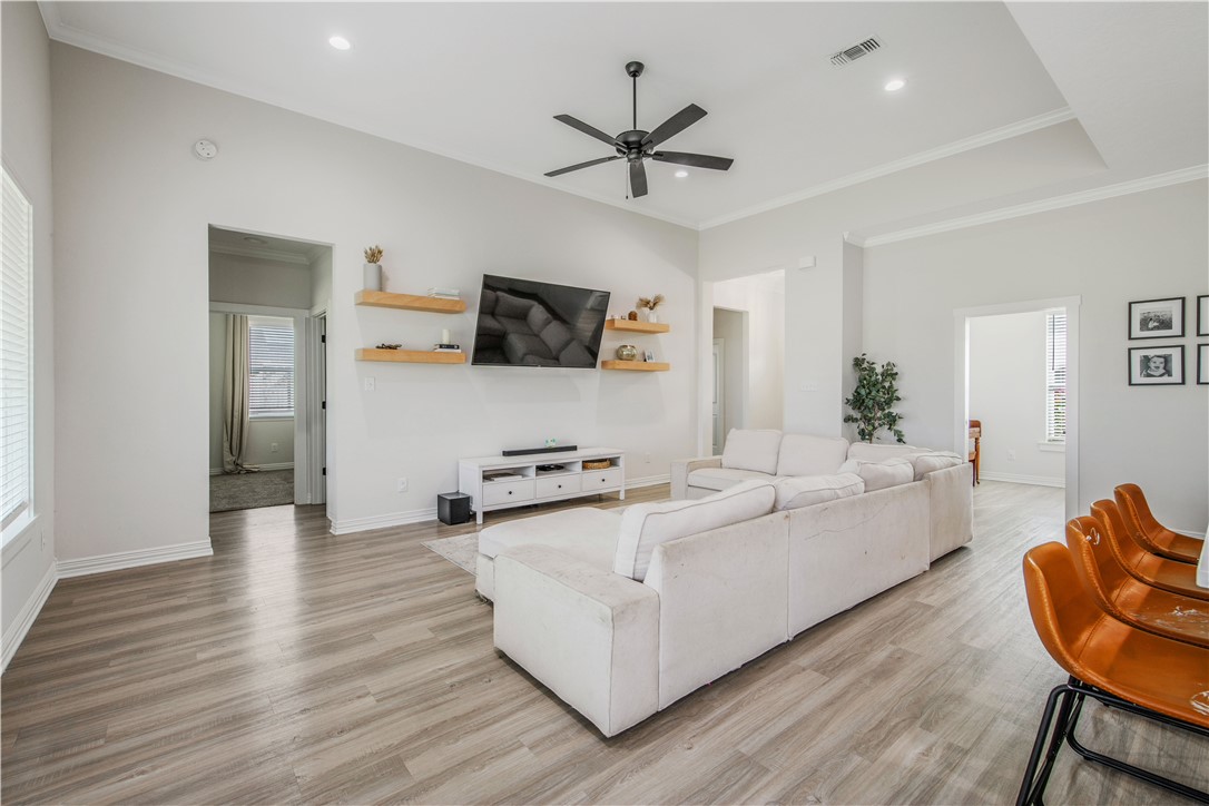 3332 Hunters Crossing Bryan, TX 77808 - Photo 20 of 26 a living room with furniture and a flat screen tv
