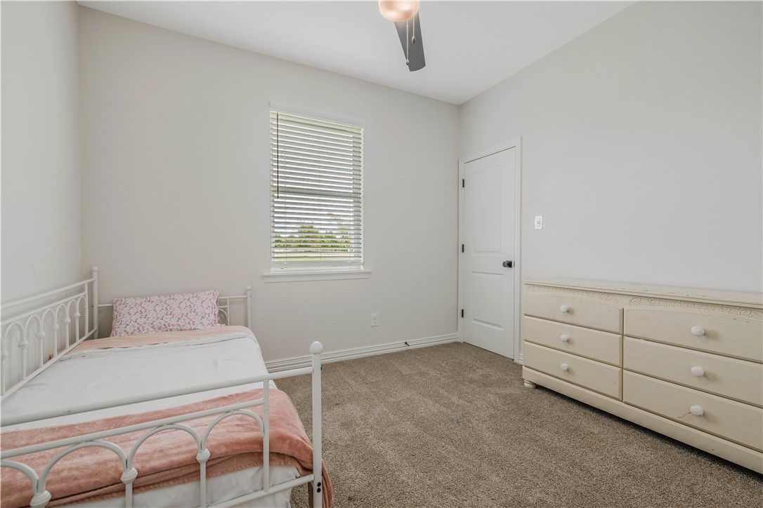 3332 Hunters Crossing Bryan, TX 77808 - Photo 9 of 26 a room with a bed and a window