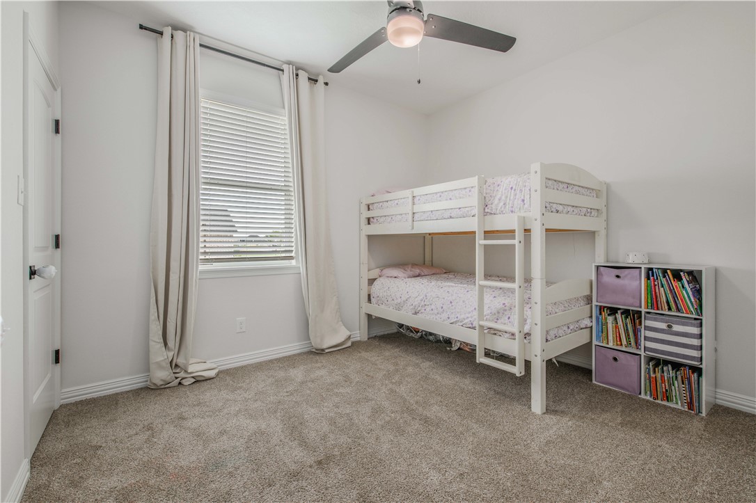 3332 Hunters Crossing Bryan, TX 77808 - Photo 10 of 26 a bed room with furniture and closet
