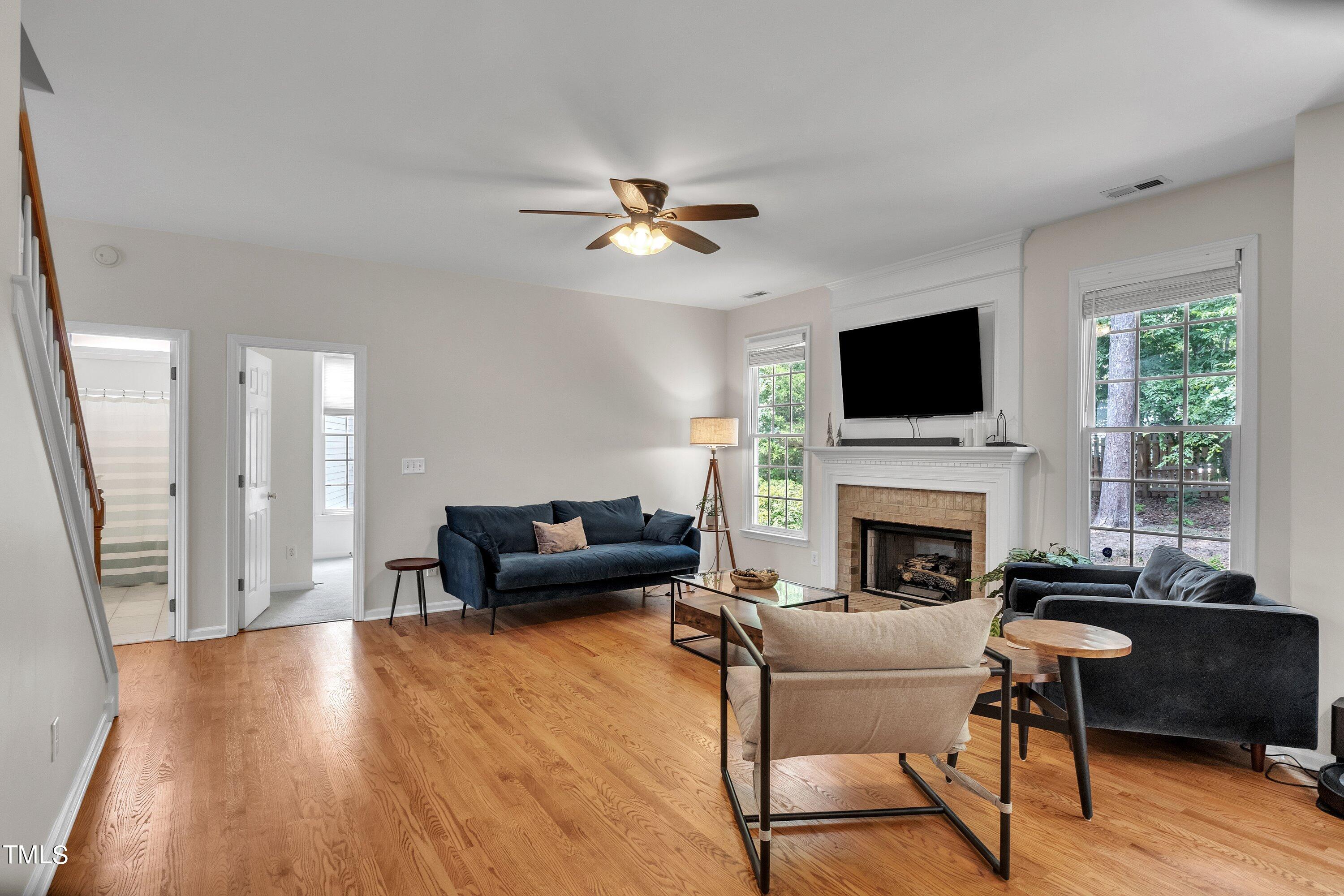 4702 Regency Drive Durham, NC 27713 - Photo 12 of 45 a living room with furniture fireplace and a flat screen tv