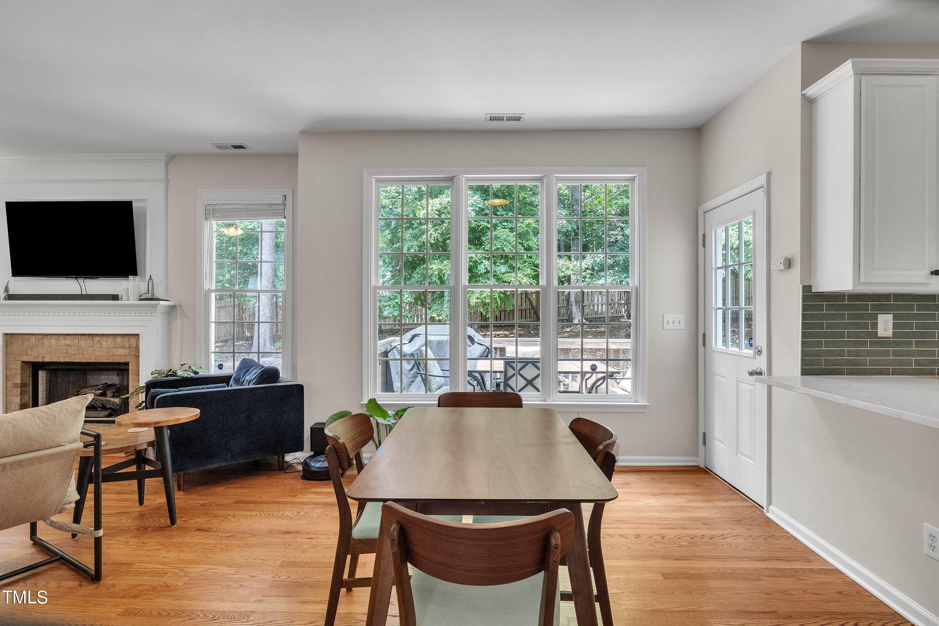 4702 Regency Drive Durham, NC 27713 - Photo 14 of 45 a view of a dining room with furniture window and wooden floor