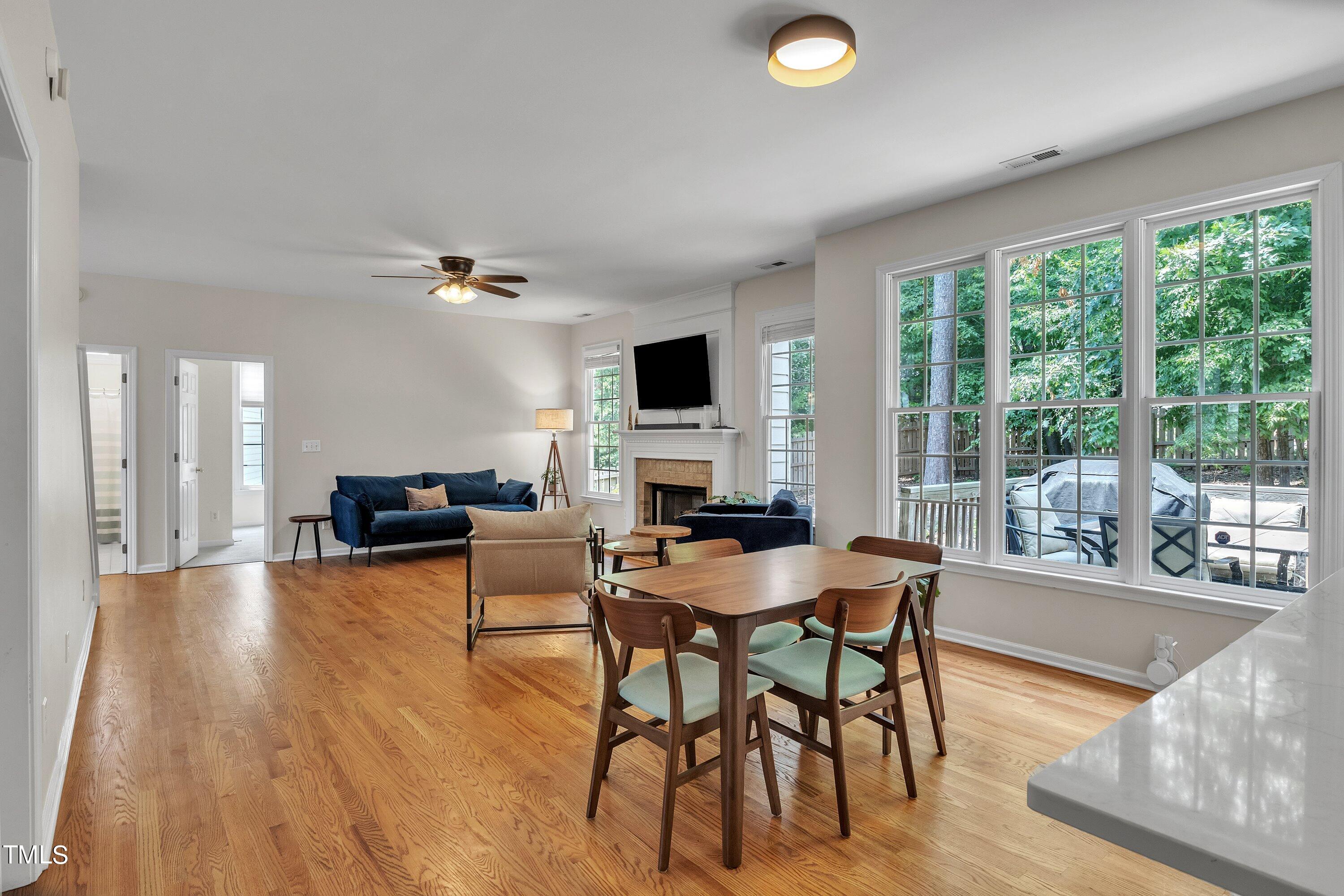 4702 Regency Drive Durham, NC 27713 - Photo 21 of 45 a view of a dining room with furniture window and wooden floor