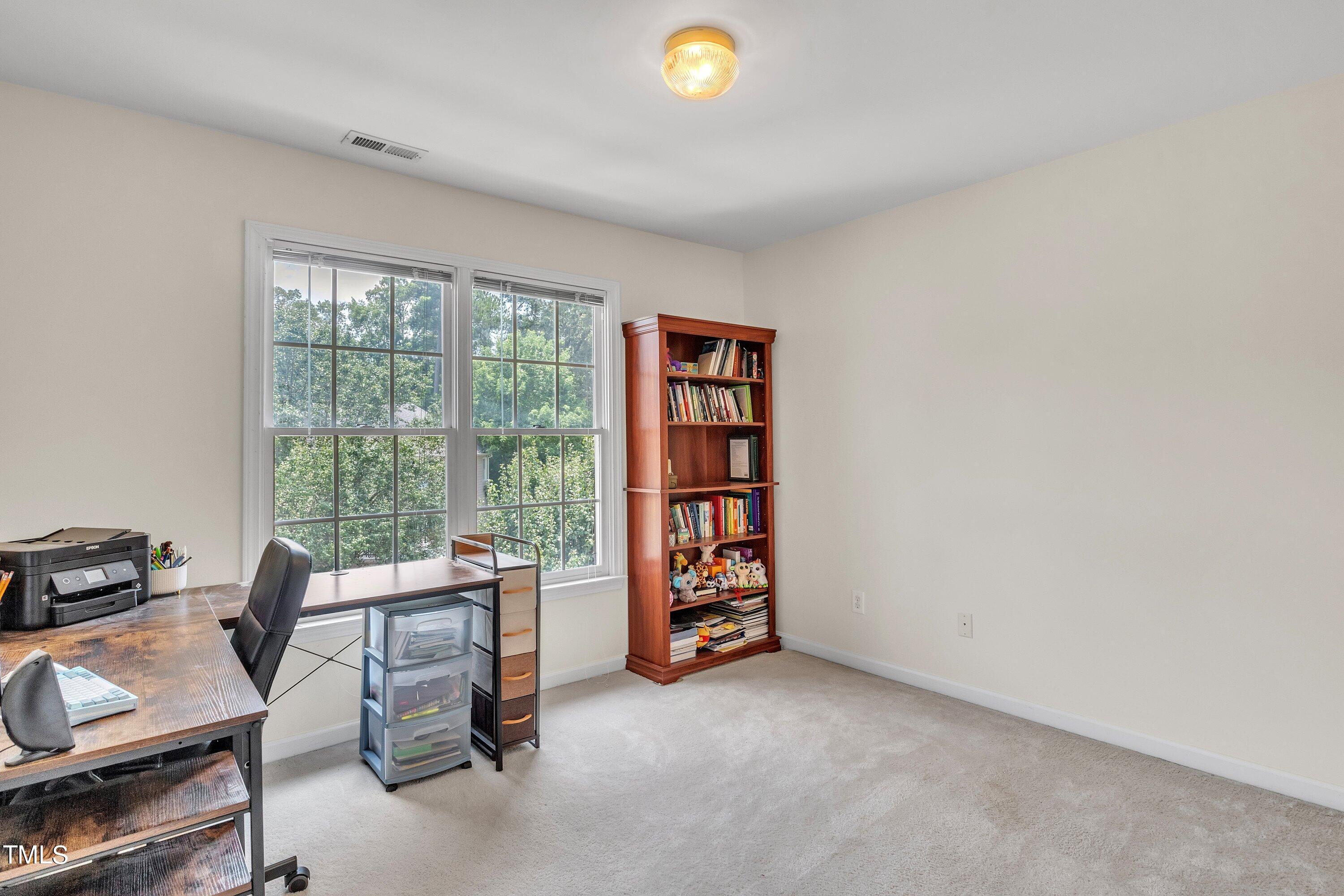 4702 Regency Drive Durham, NC 27713 - Photo 37 of 45 a view of work space with furniture and a window