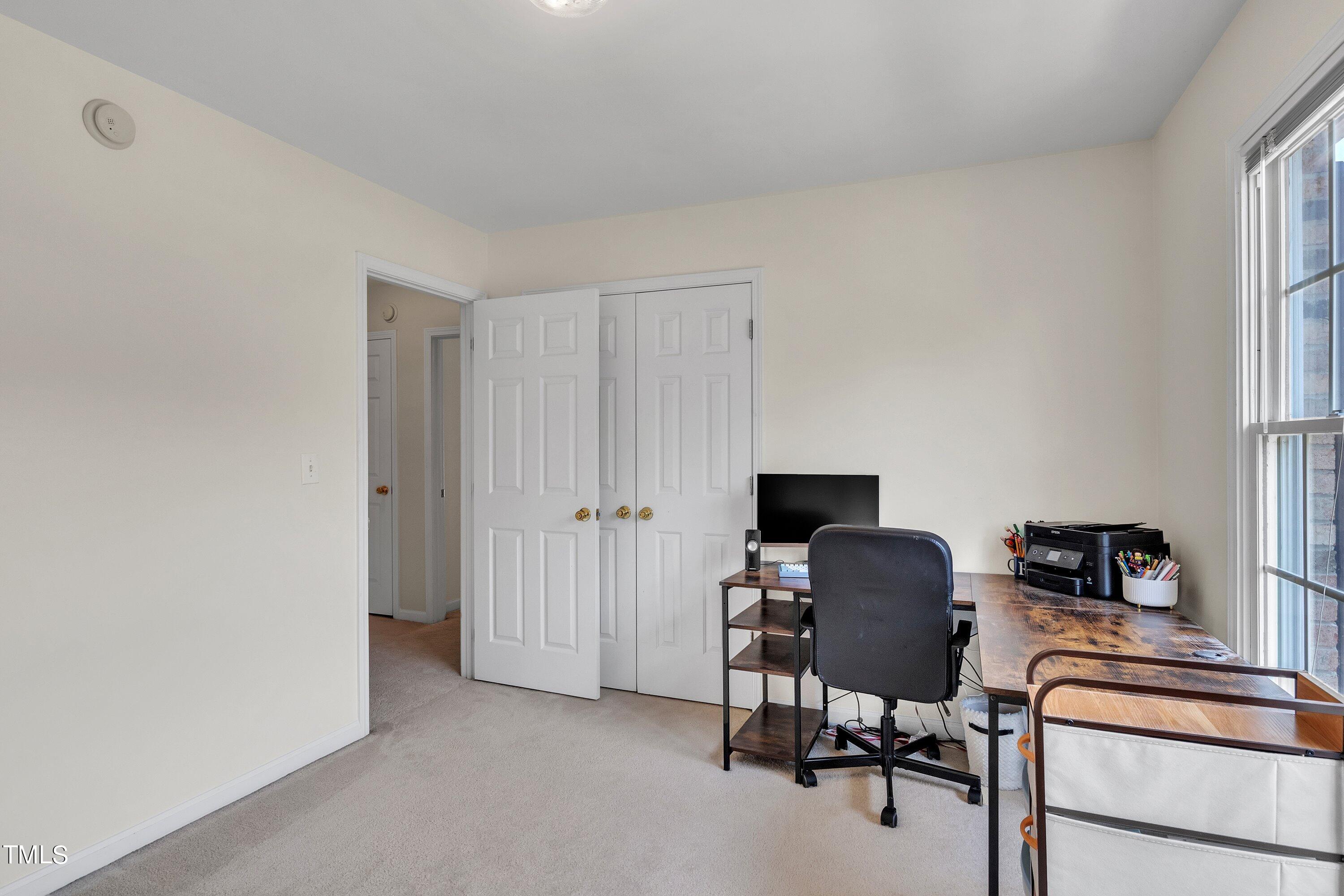 4702 Regency Drive Durham, NC 27713 - Photo 38 of 45 a view of a workspace with furniture and a window