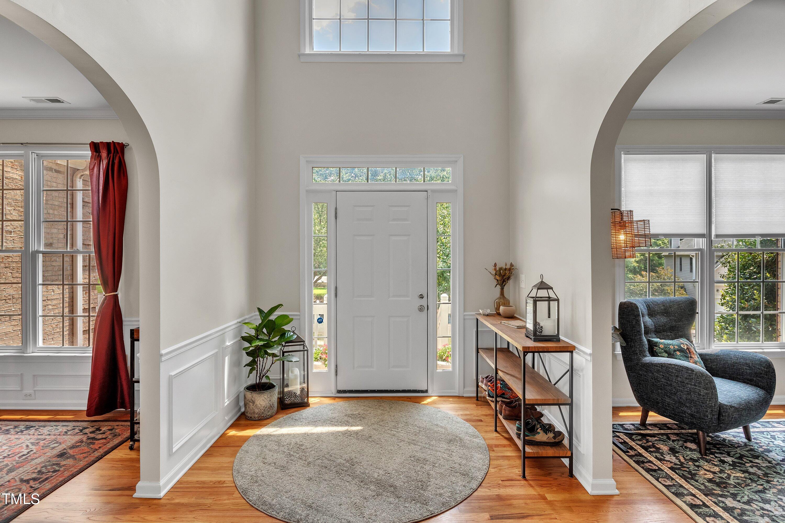 4702 Regency Drive Durham, NC 27713 - Photo 4 of 45 a view of a livingroom with furniture and a potted plant