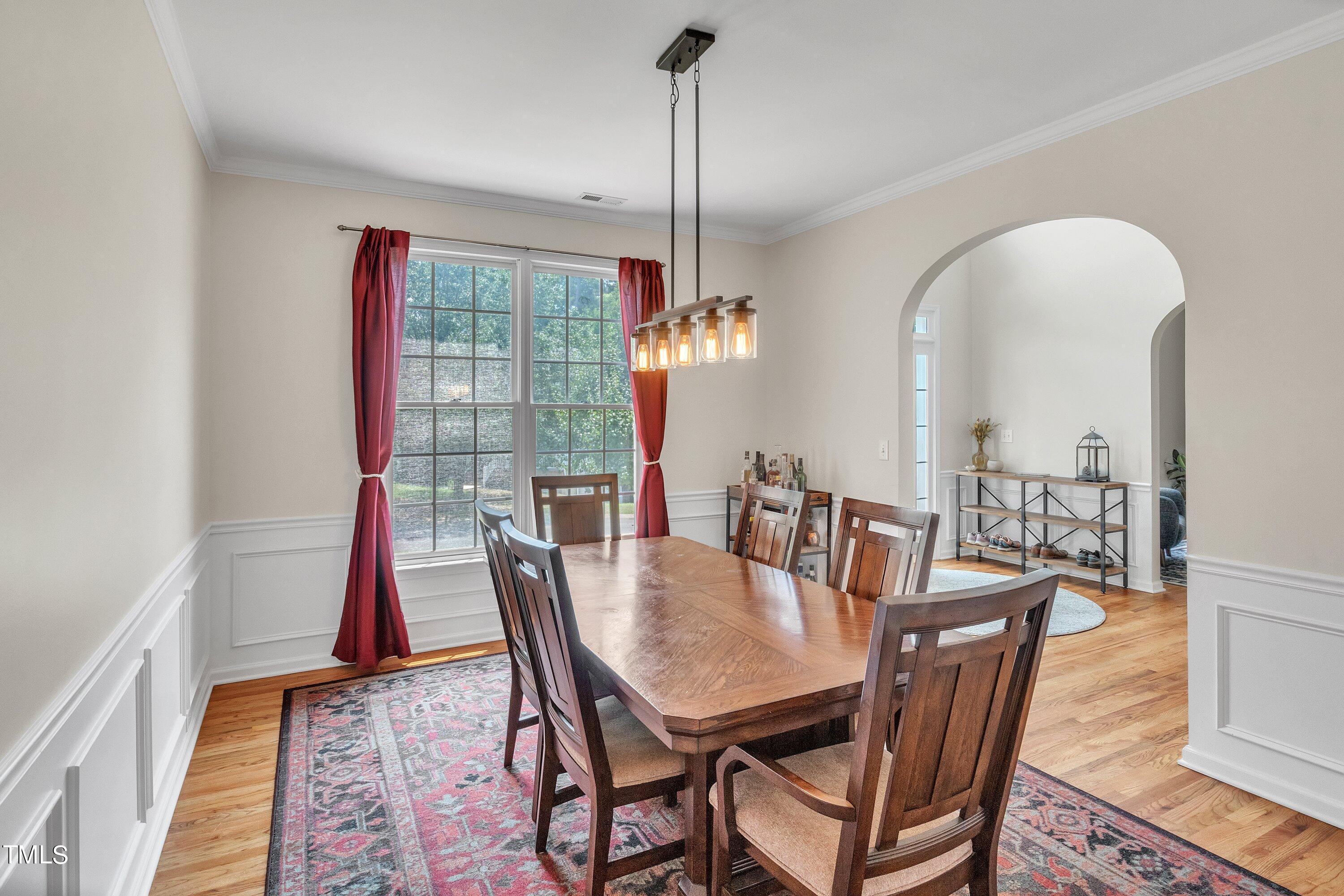 4702 Regency Drive Durham, NC 27713 - Photo 7 of 45 a view of a dining room with furniture window and wooden floor