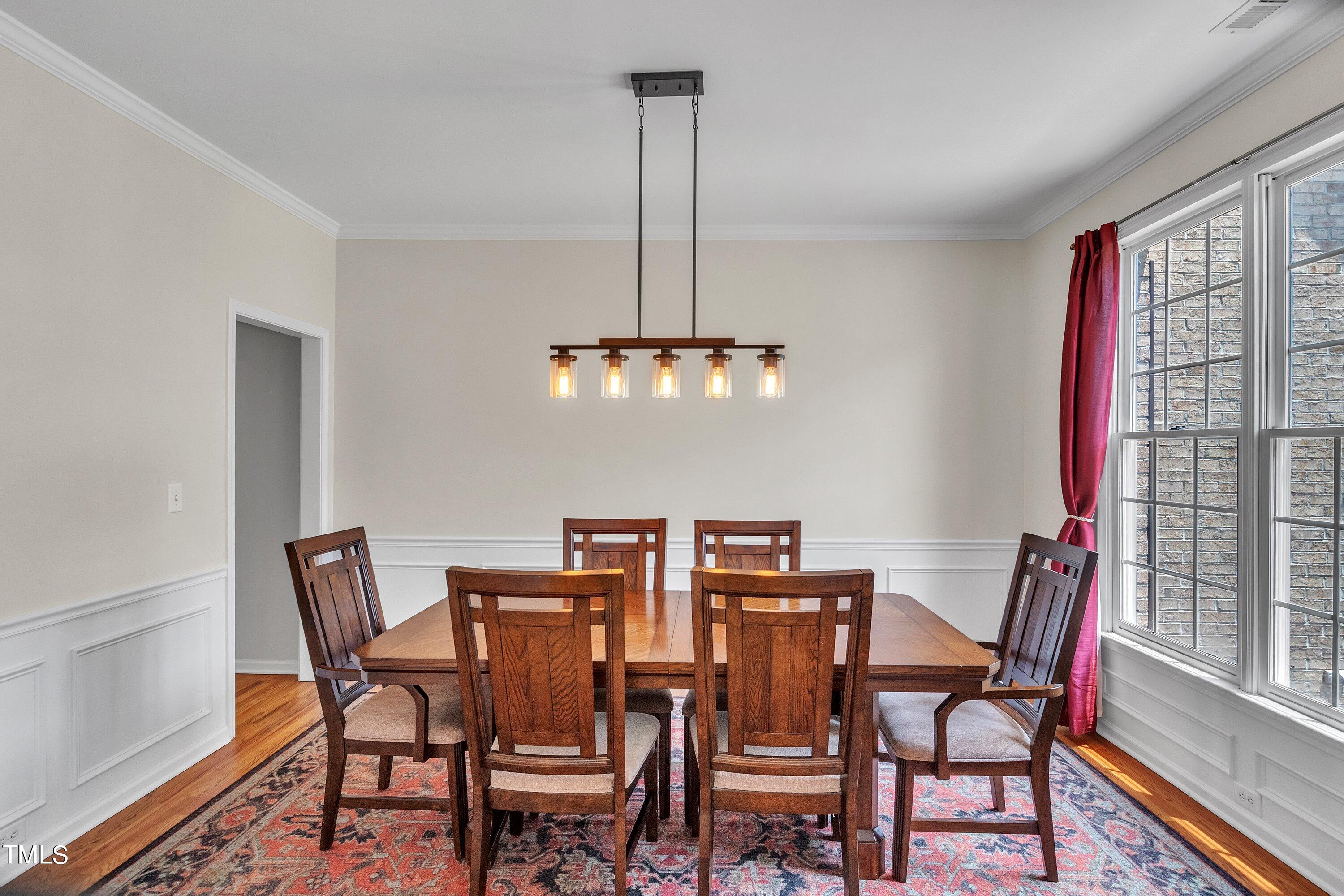 4702 Regency Drive Durham, NC 27713 - Photo 8 of 45 a view of a dining room with furniture window and wooden floor