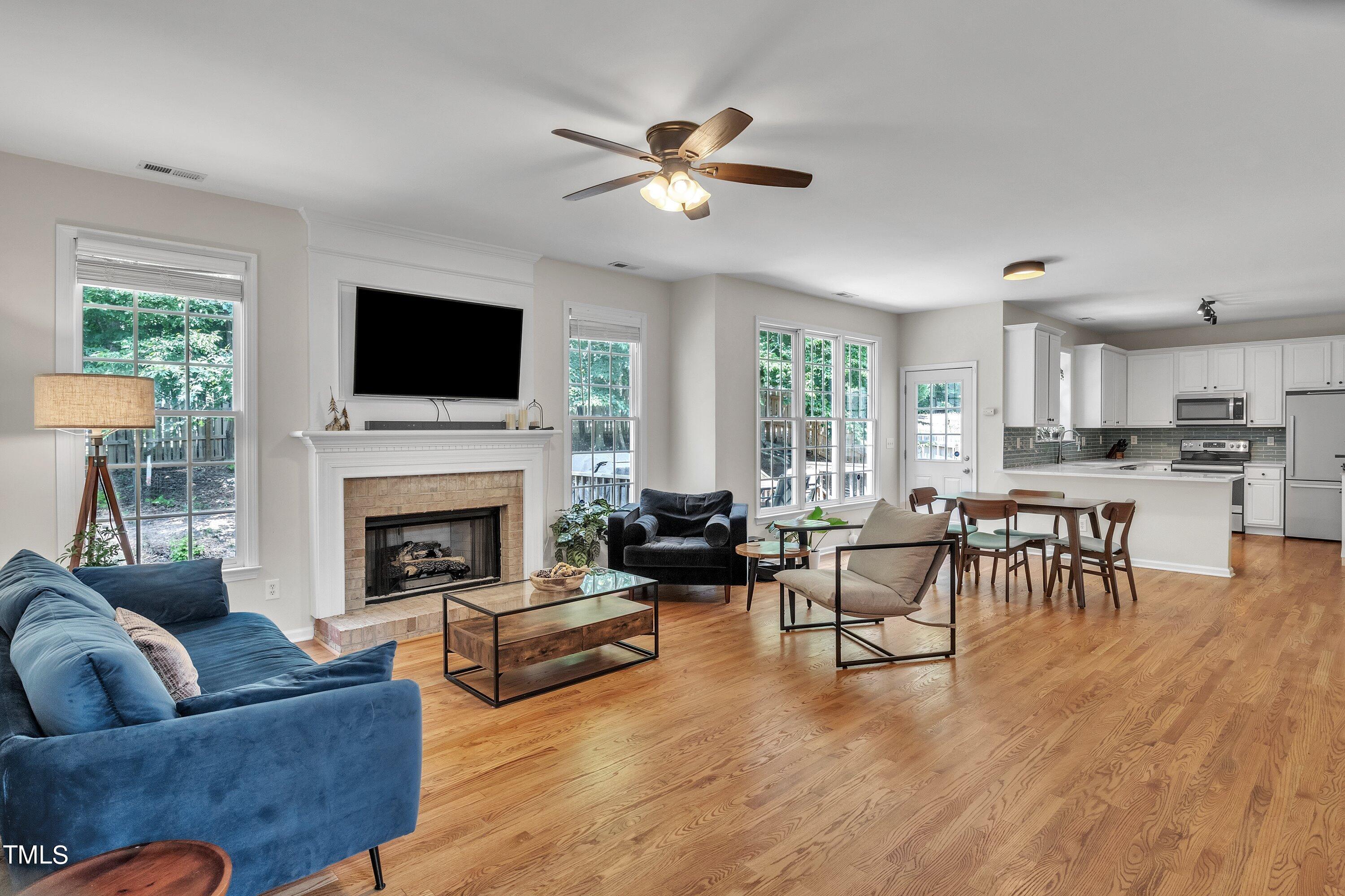 4702 Regency Drive Durham, NC 27713 - Photo 9 of 45 a living room with furniture fireplace and a flat screen tv
