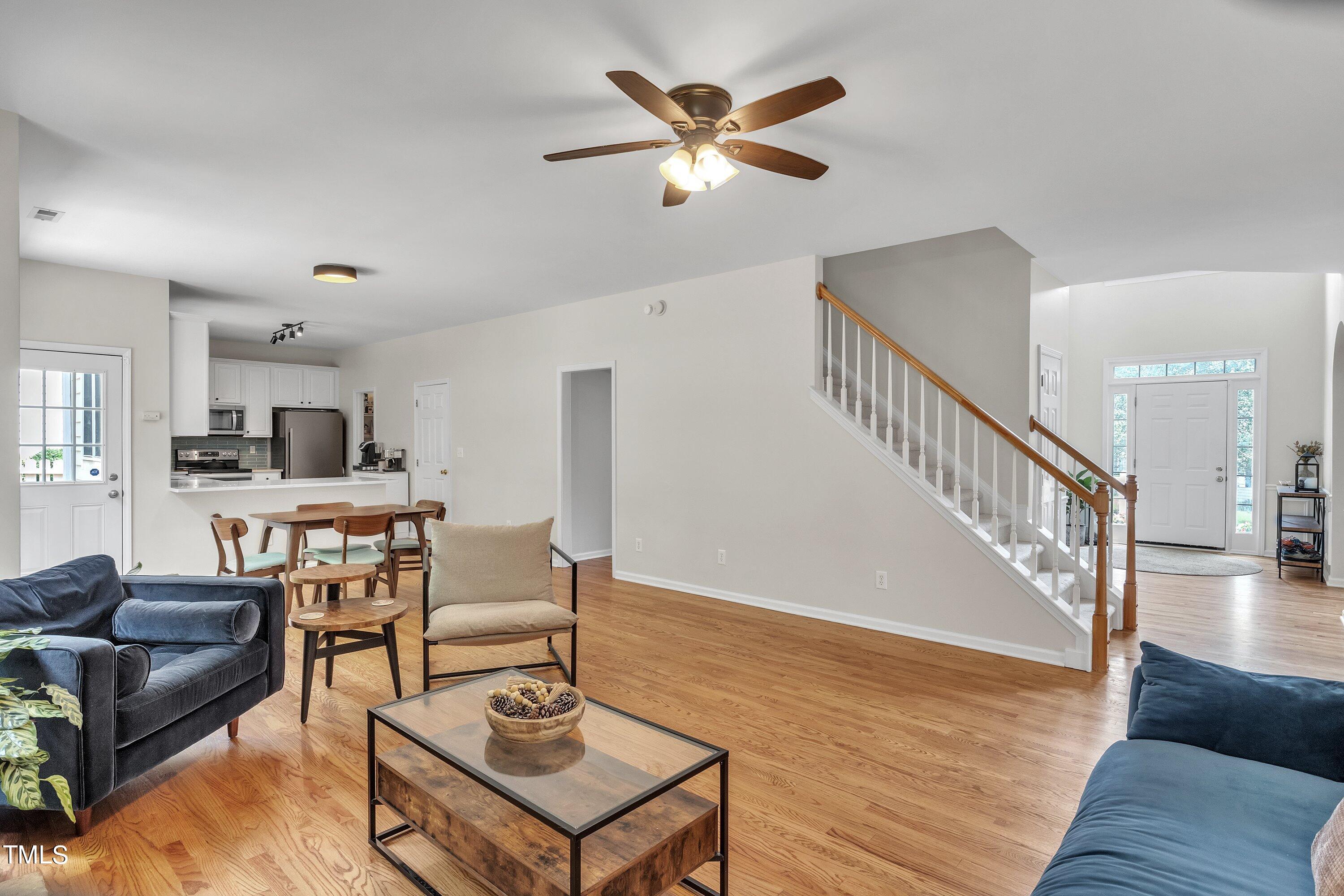 4702 Regency Drive Durham, NC 27713 - Photo 10 of 45 a living room with furniture and wooden floor