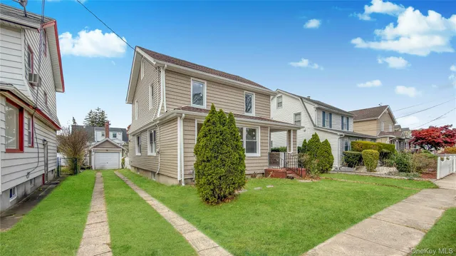 a view of backyard with a garden and plants