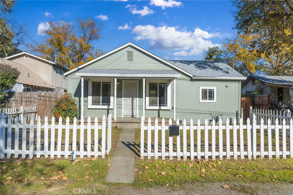 a front view of a house with a small yard