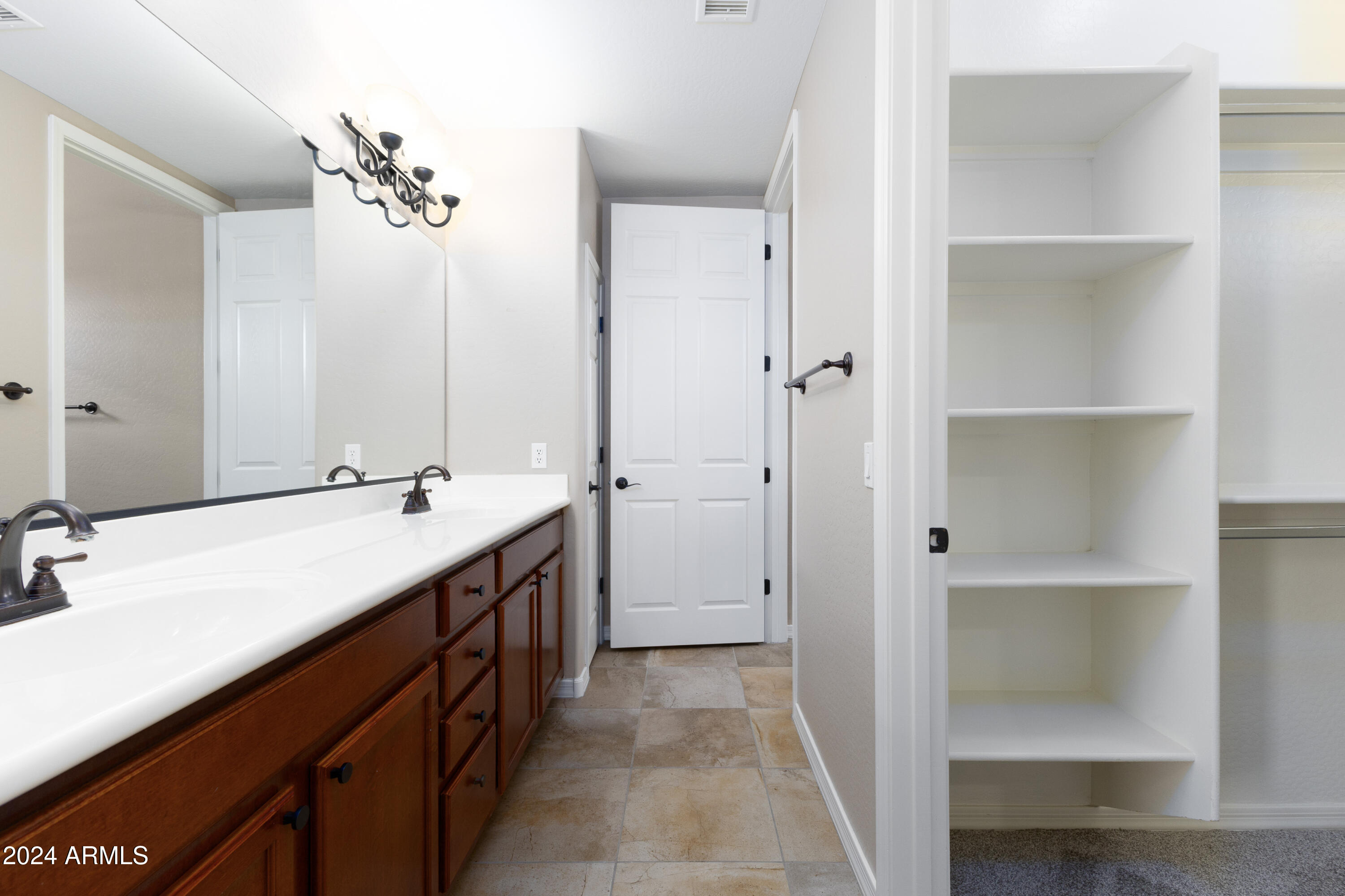 3330 South Gilbert Road, Unit 2010 Chandler, AZ 85286 - Photo 13 of 20 a spacious bathroom with a double vanity sink a mirror and a shower