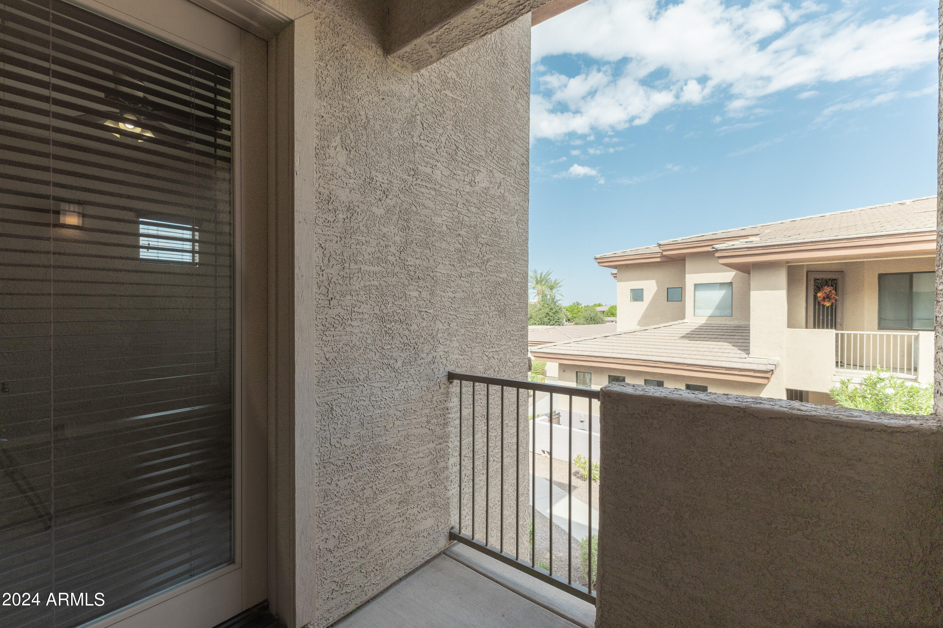 3330 South Gilbert Road, Unit 2010 Chandler, AZ 85286 - Photo 16 of 20 a side view of a house with a balcony