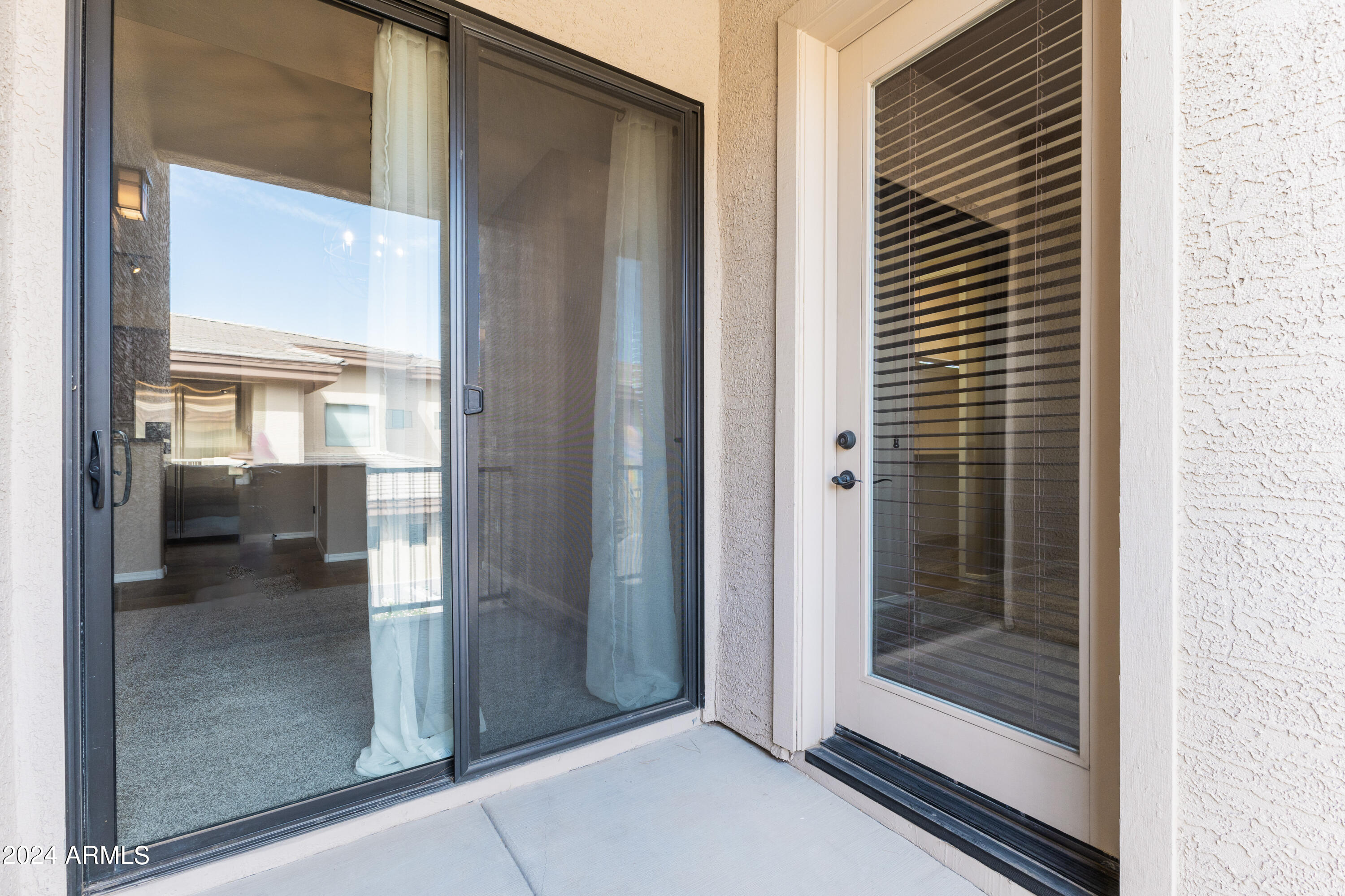 3330 South Gilbert Road, Unit 2010 Chandler, AZ 85286 - Photo 17 of 20 a bathroom with a glass shower door and a mirror