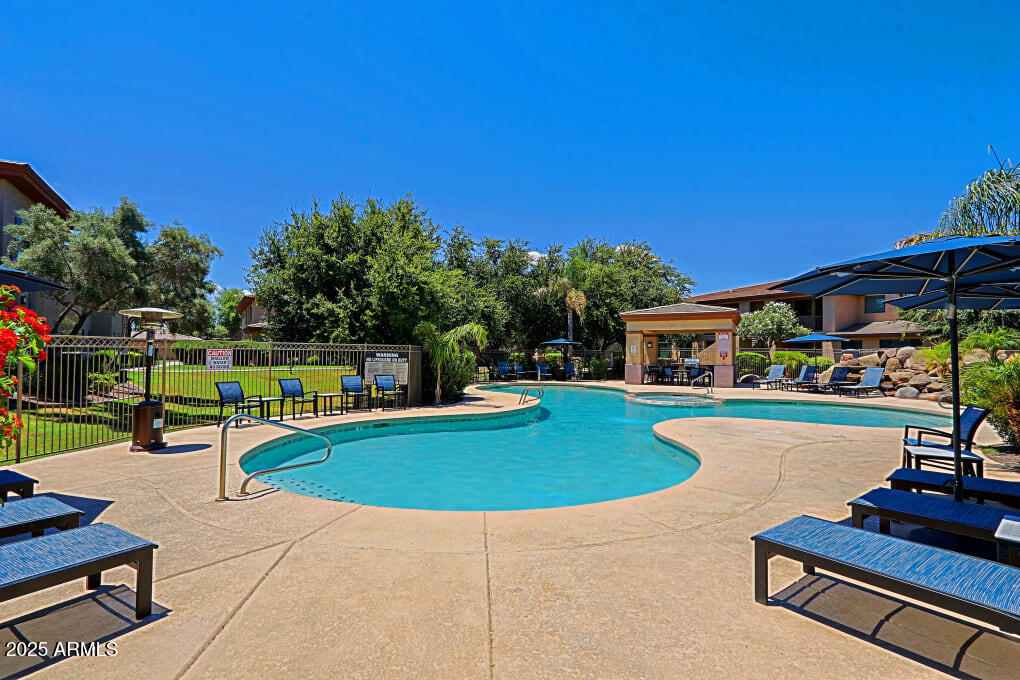 3330 South Gilbert Road, Unit 2010 Chandler, AZ 85286 - Photo 18 of 20 a swimming pool with outdoor seating and yard